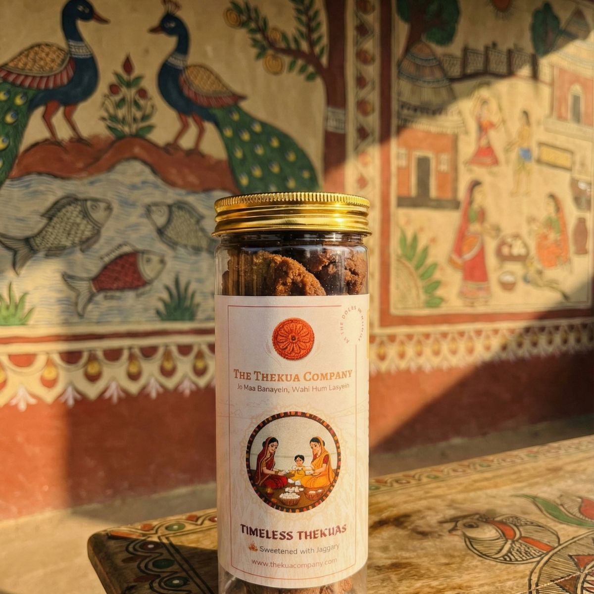 thekua 250gm pack in front of mithila painting